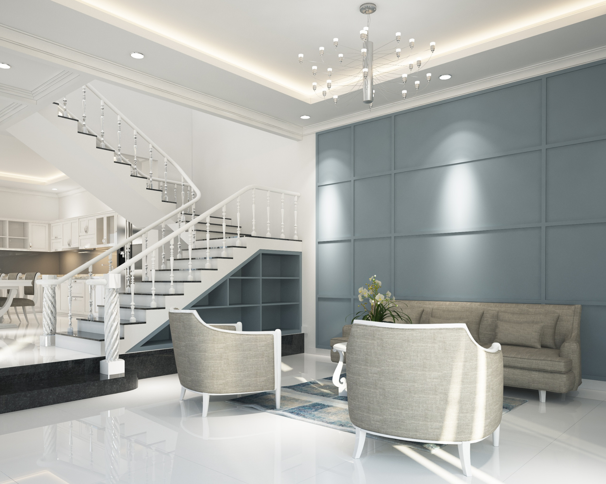Open-plan staircase and lounge with a grey tufted sofa opening onto the kitchen